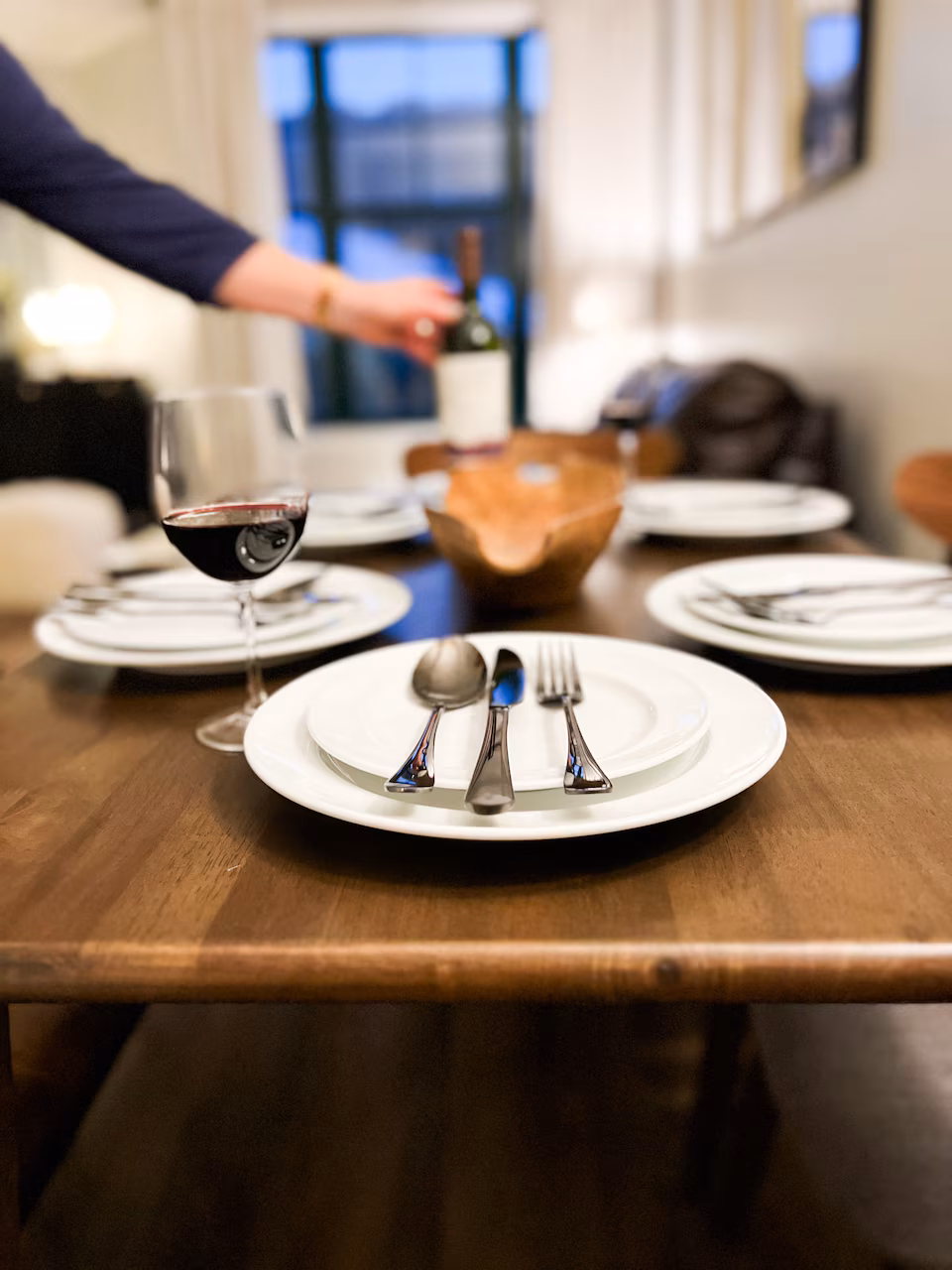 Fully Set Dining Room Table with wine glass